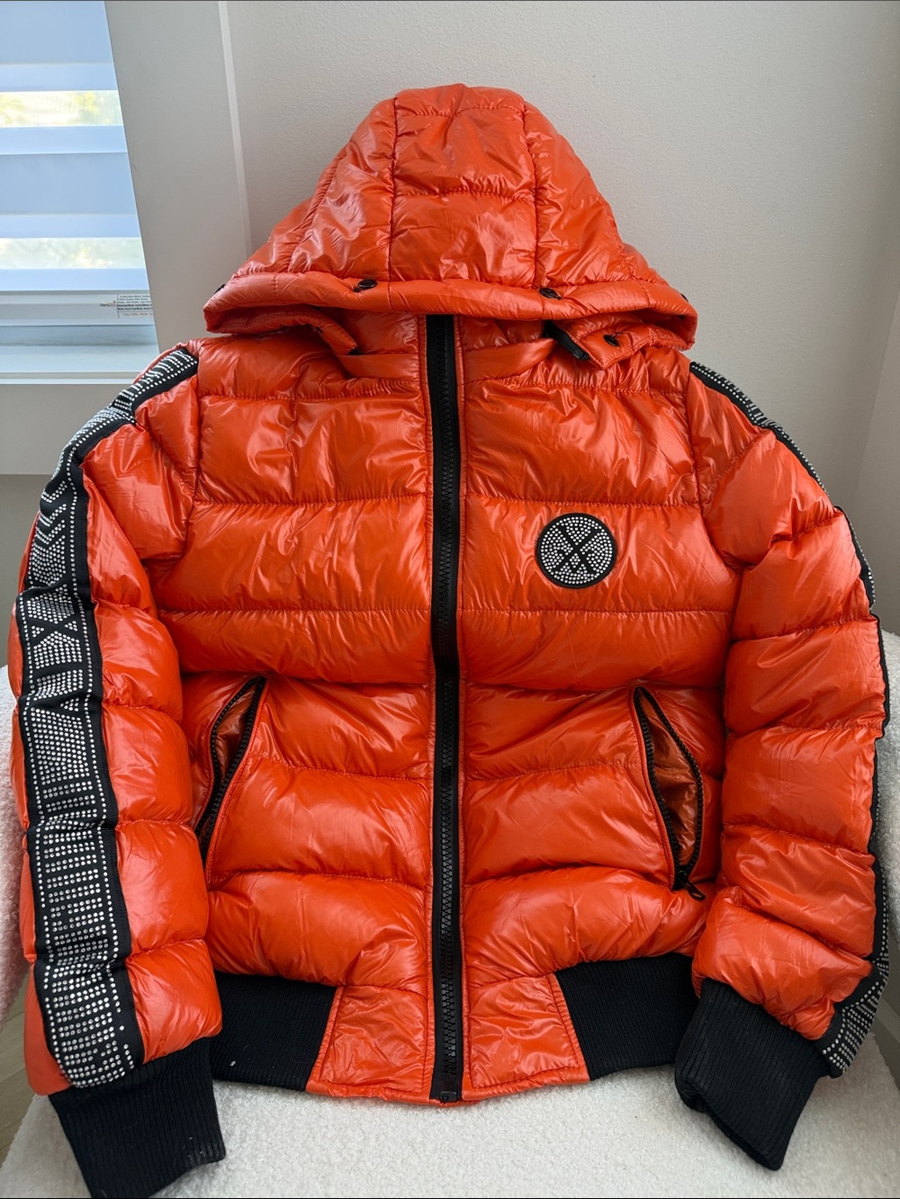 Orange Hooded Puffer Jacket with Embroidered Patch
